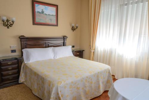 Ένα ή περισσότερα κρεβάτια σε δωμάτιο στο Casa Lourido Lires