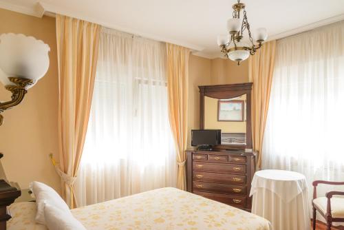 Ένα ή περισσότερα κρεβάτια σε δωμάτιο στο Casa Lourido Lires