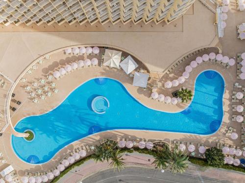 an overhead view of a swimming pool at a resort at SOL by Meliá Guadalupe in Magaluf