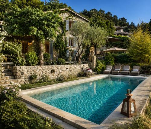 a swimming pool in the backyard of a house at Les Rosées in Mougins