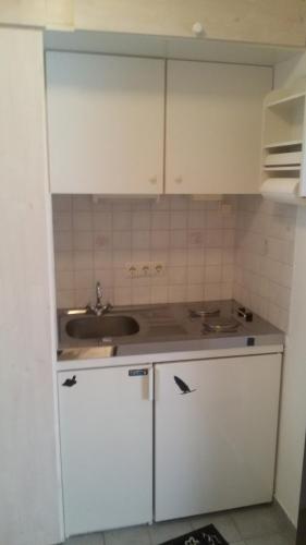 Η κουζίνα ή μικρή κουζίνα στο Gemütliches Apartment direkt am Strand