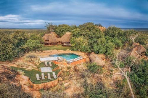 an aerial view of a house with a swimming pool at Elewana Elsa's Kopje in Meru