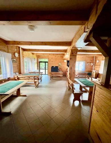 a large room with several ping pong tables in it at NOCLEGI NOVA in Krasnobród