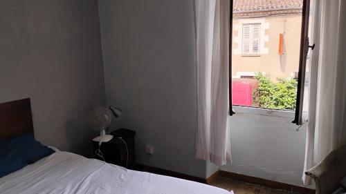 a bedroom with a bed and a window at Number 33 Village house in Rancon sleeps 4 in Rancon
