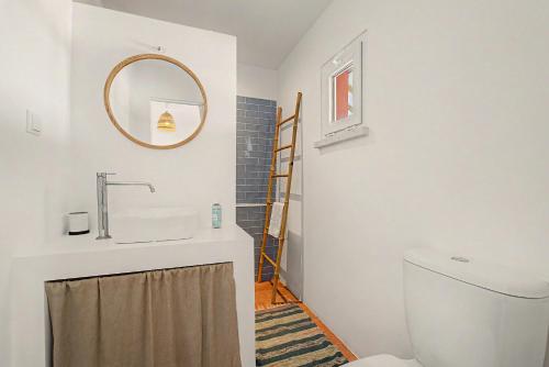 a bathroom with a sink and a toilet at Monte Do Poço Country House in Erra