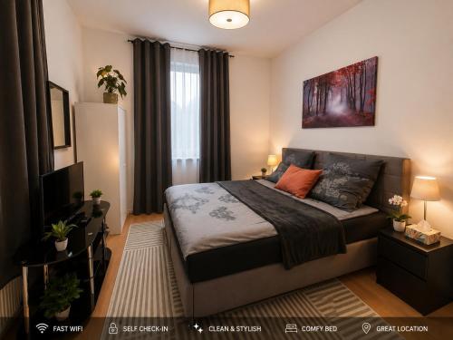 a bedroom with a bed and a television in it at Bright and Elegant Private Room in Dresden