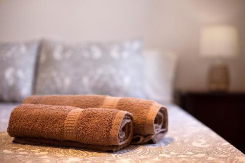 two towels are sitting on top of a bed at Casa Yoaki in Corralejo