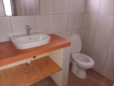 a bathroom with a sink and a toilet at Red Rocks Accommodation in Northam