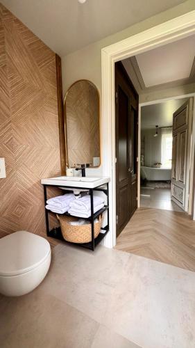 a bathroom with a sink and a mirror at Kõpu Seaside Getaway in Rannaküla