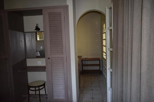 a hallway with a door leading to a kitchen at Villa Rododafni in Roda