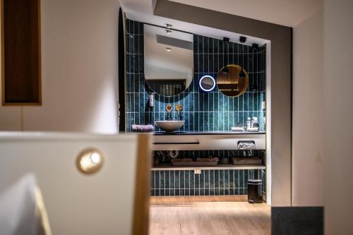 a bathroom with a sink and a mirror at Edlgütl - Hideaway in Breitenberg