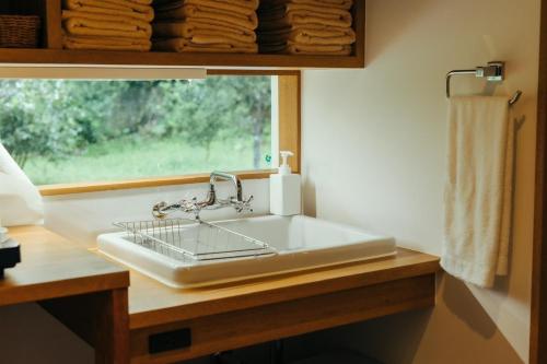 a white sink in a bathroom with a window at MANANI - Vacation STAY 16612v in Nago