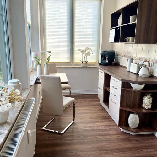 a kitchen with a desk and a chair in it at Wellness-Oase-Nossen Kirchblick in Nossen