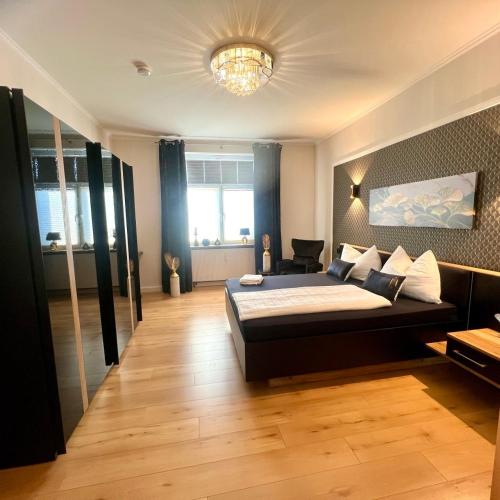 a bedroom with a large bed in a room at Wellness-Oase-Nossen Kirchblick in Nossen