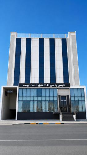 a large building with a sign on the front of it at NARS Plus Serviced Apartments - Al Nuzha in Jeddah
