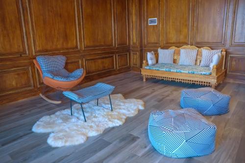 a living room with two chairs and a couch at Noora Resort Bishoftu in Debre Zeyit