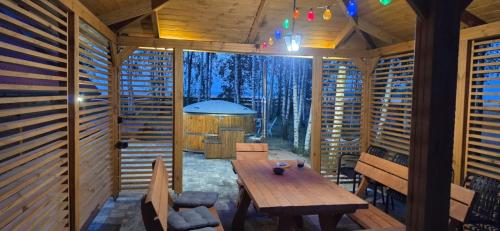 a room with a wooden table in a house at Wypoczynek "POD BRZÓSTKAMI" in Nagłowice