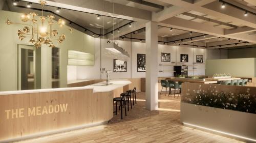una hall con bar e zona pranzo di MEADOW Gronau by Hackmann a Gronau