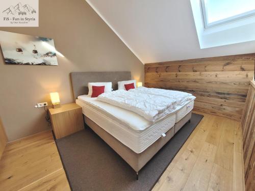 a bedroom with a large bed in a room at Mountain Suite A10 - by FiS in Tauplitz