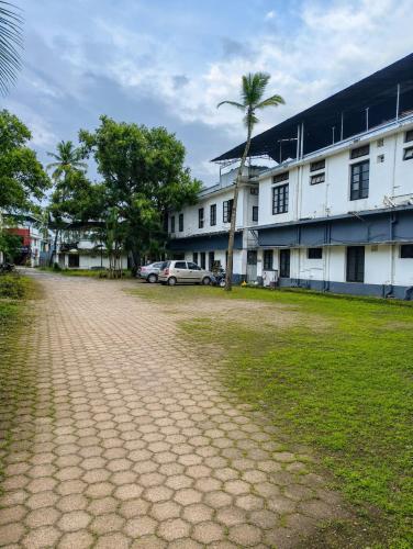 an empty street in front of a building at PRATHIBA RESIDENCY in Kollam