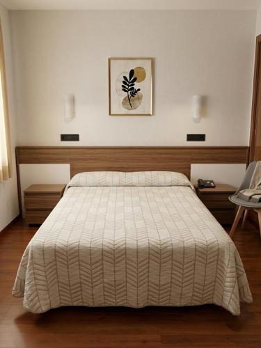 เตียงในห้องที่ Hotel Pelayo