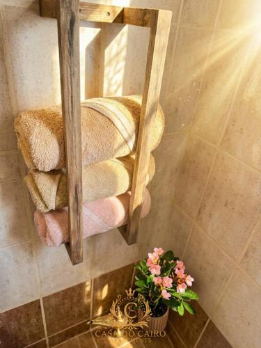 a mirror in a bathroom with a shelf with towels at Casa Do Cairo-Sharm Alsheikh in Sharm El Sheikh