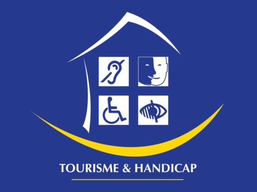 a house with a symbol of tolerance and handicap at Mercure Paris La Défense in Courbevoie