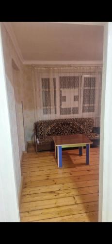 a living room with a couch and a table at Ma ry in Jvari