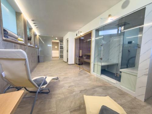 a office with a chair and a glass wall at Villa Petar Stone in Kamensko