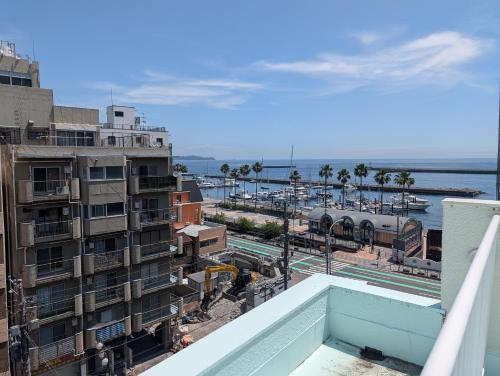 a view from the balcony of a building at Liminal in Atami