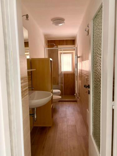 a bathroom with a sink and a toilet at I Due Timidi in Putignano