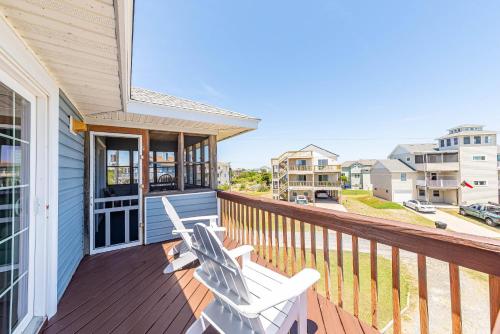 a balcony with two white chairs on a house at Knottaway - Duck, Sound Sea Village, Ocean View, 125 Yds to Beach, Pets OK, Flex Stays in Duck