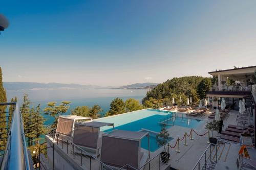 a swimming pool with a view of the water at Inex Olgica Hotel & SPA in Ohrid