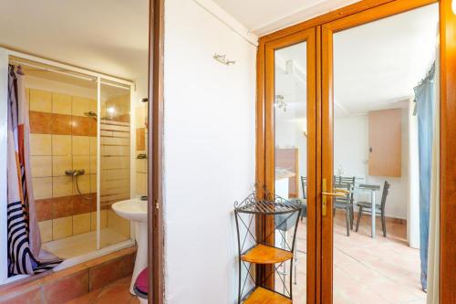 a bathroom with a shower and a toilet and a sink at Appartement de charme en Ardèche in Aubenas