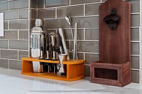 a kitchen counter with a coffee maker on a wooden shelf at Lux, Fenced Backyard 4 Pets, Firepit, Exec Desk in Dallas