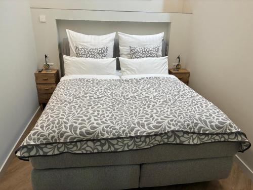 a bedroom with a large bed with white pillows at Apartment in Berlin-Köpenick in Berlin