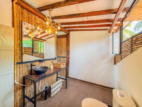 a bathroom with a sink and a mirror at Finca Campestre Doradal in Doradal