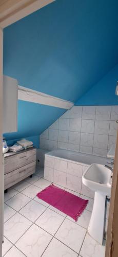 a bathroom with a sink and a toilet at Hébergement VIGNES ET RIVIERES in Écuelles