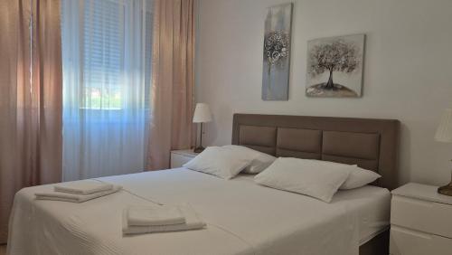 Voodi või voodid majutusasutuse Leona apartment-perfect for four toas