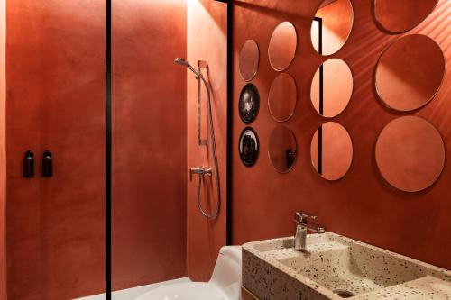 a bathroom with a shower and a sink at Obra Hotels in Medellín