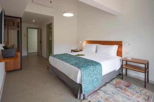 a bedroom with a large bed in a room at Pouso Alforria in Tiradentes