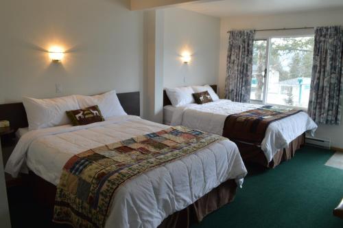 Säng eller sängar i ett rum på Motel Tyrol