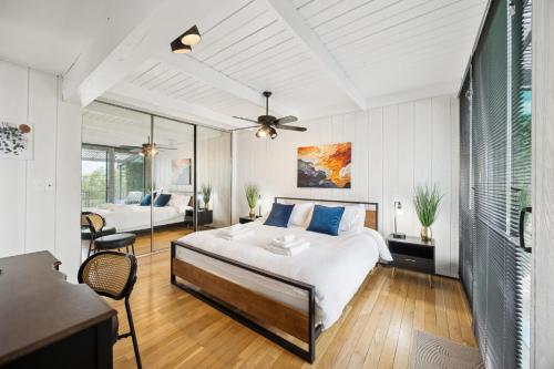 a bedroom with a bed and a living room at Luxe Mt Adams Lookout in Cincinnati