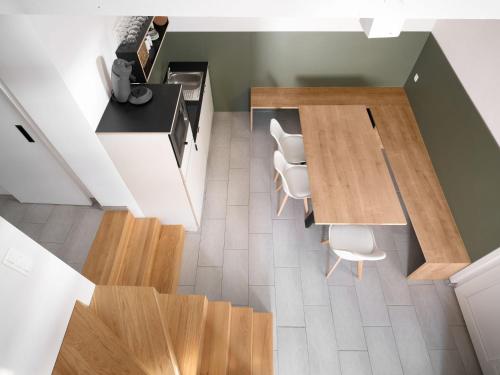 an overhead view of a kitchen with a table and chairs at Aparthouse HAAS41 - Eupen in Eupen
