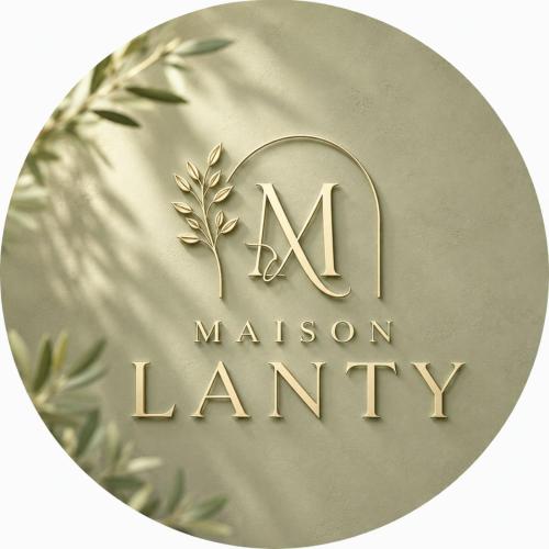 a gold medal with the initials ma and a mission lane at Maison Lanty in Lanty