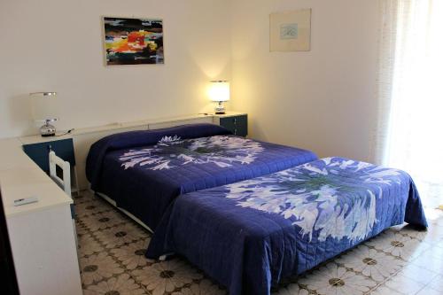 Posteľ alebo postele v izbe v ubytovaní Appartamenti Giulia