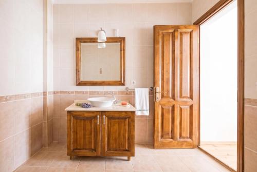 a bathroom with a sink and a mirror at Alayaz Hotel in Alaçatı