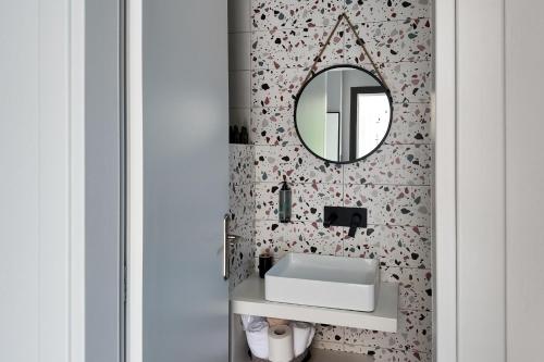 a bathroom with a sink and a mirror at Green Hill Thassos in Skala Potamias