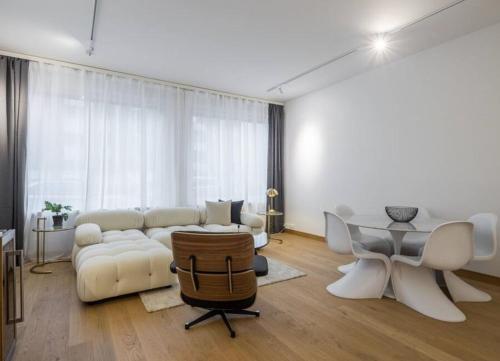 a living room with a couch and a table at City Choice Apartment in Helsinki