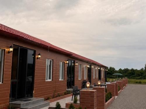 a row of cottages with lights on them at Tornikes Cottages in Ureki